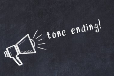 Black chalkboard with drawing of a loudspeaker and inscription tone ending