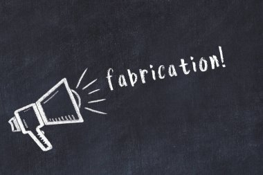 Black chalkboard with drawing of a loudspeaker and inscription fabrication