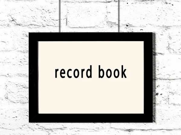 Black Wooden Frame Inscription Record Book Hanging White Brick Wall — Stockfoto