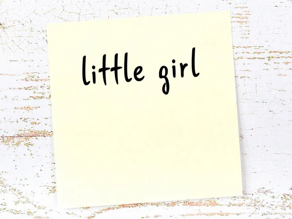 Concept Reminder Little Girl Yellow Sticky Sheet Paper Wooden Wall — Fotografia de Stock