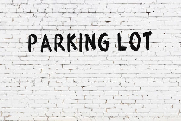 Inscription Parking Lot Written Black Paint White Brick Wall — Foto Stock