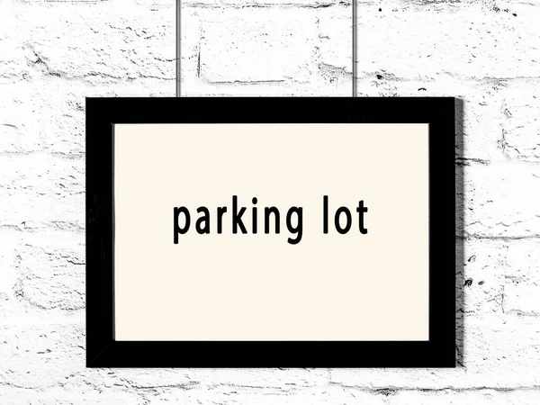 Black Wooden Frame Inscription Parking Lot Hanging White Brick Wall —  Fotos de Stock