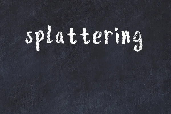 Inscription splattering written with black paint on white brick wall.