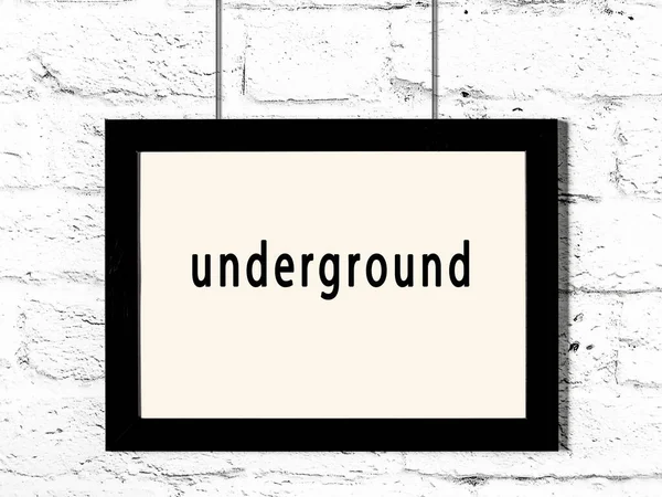 Black Wooden Frame Inscription Underground Hanging White Brick Wall — Stockfoto