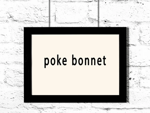 Black Wooden Frame Inscription Poke Bonnet Hanging White Brick Wall — Stockfoto