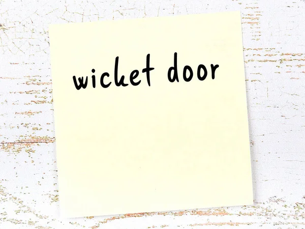 Yellow Sticky Note Wooden Wall Handwritten Inscription Wicket Door — стоковое фото