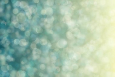 Bokeh ile soyut bir arkaplan. Yumuşak ışık odaklı noktalar.