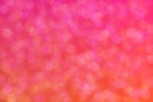 주황색에서 분홍색 육각형에 이르는 기울기 추상적 배경은 임의의 무늬를 만들었다 — 스톡 사진