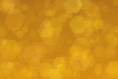 Altıgen şekilli bokeh benekleri ile odaklanmış altın soyut arkaplan