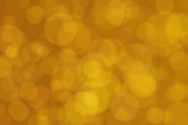 Çember şeklindeki bokeh noktalarıyla odaklanmış altın soyut arkaplan