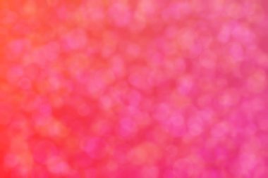 turuncu ve pembe soyut çözünmüş arka plan daire şeklindeki bokeh noktalarıyla