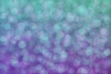 Çember şekilli bokeh benekli mor ve yeşil soyut odaklı arkaplan
