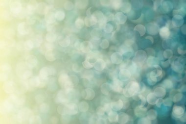 Bokeh ile soyut bir arkaplan. Yumuşak ışık odaklı noktalar.