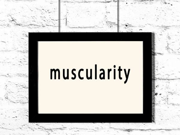 Black Wooden Frame Inscription Muscularity Hanging White Brick Wall — Stock Photo, Image