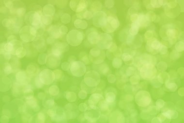 Çember şekilli bokeh benekli yeşil soyut odaklanmış arkaplan