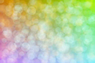 Kahverengi ve mavi soyut çember şeklindeki bokeh noktalarıyla odaklanmış arkaplan