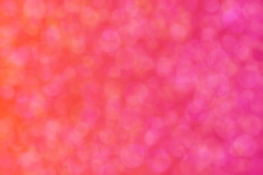 turuncu ve pembe soyut çözünmüş arka plan daire şeklindeki bokeh noktalarıyla