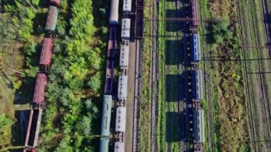 Railway Station with lots of Lines and Freight Trains. Aerial View