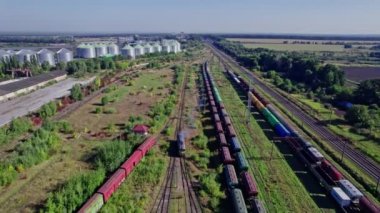 Railway cargo station junction with lot of trains and track lines