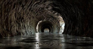 3 boyutlu görüntüleme. Kayanın içinden geçen tünelin sonundaki ışık. Dağdaki mağaranın sonunda bir çıkış var..