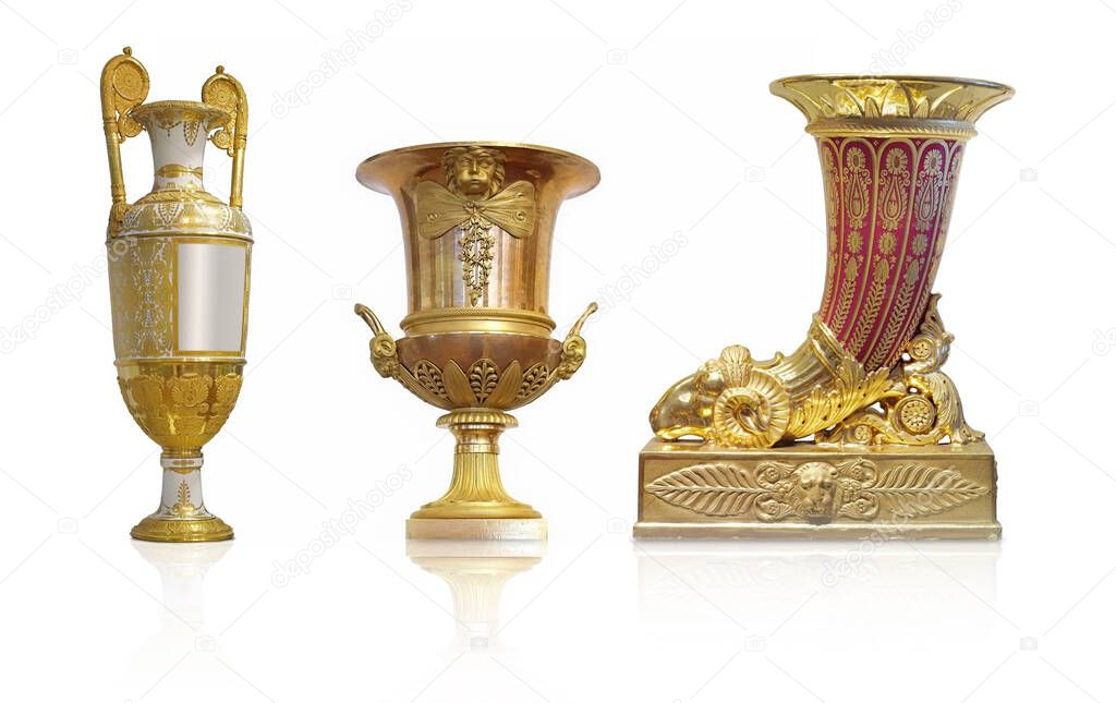 Set of porcelain vases with a gold ornament isolated on a white background