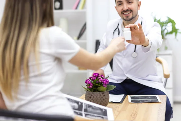 Photo of pregnant woman visiting her doctor. Stock Picture