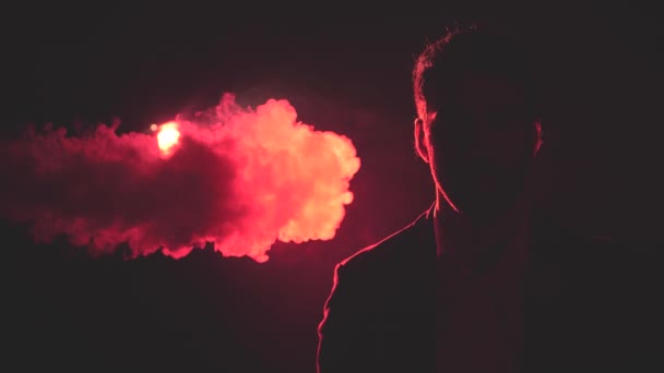 4k slow motion video of man in shadow and smoke and pink light on the background. — Stockvideo