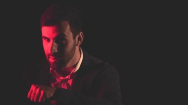 4k video of man in suit gesturing with hand across his neck. Concept of man gesturing.