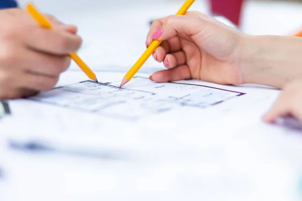 Close up photo of hands working with papers at office. Concept of office.