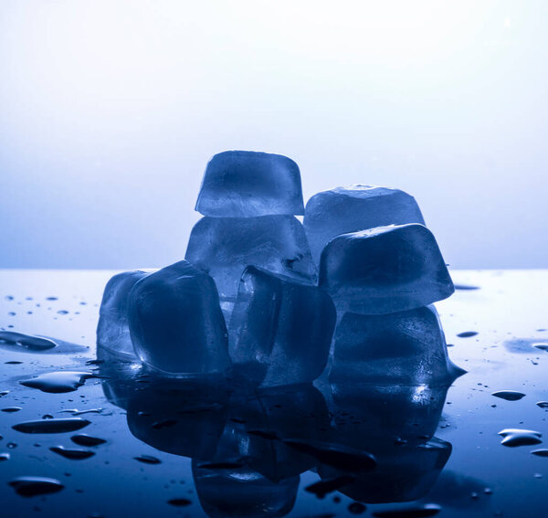 Ice cubes melting on the table