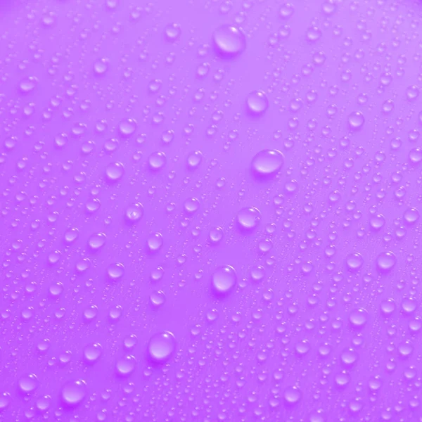 Violeta Gotas Agua Pastel Superficie Brillante Luz —  Fotos de Stock