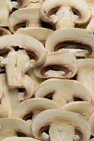 Çiğ taze şampiyon mantarları. Gıda arka planı, organik gıda 