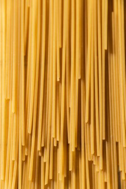 Close up of raw spaghetti pasta, food backgrounds, organic ingredients