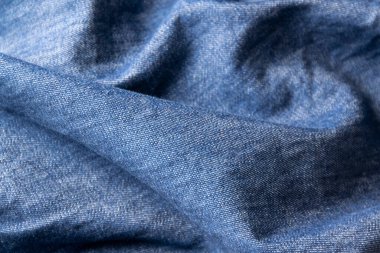 Jeans cloth, denim blue weathered material, trendy fashion textile