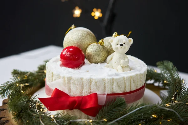 Traditional Christmas cake with fruits, nuts and white glaze with Christmas decorations. — Stock Photo, Image