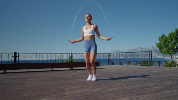 Woman Jumps Two Skipping Ropes Does Exercises Beach High Quality — Stock Video