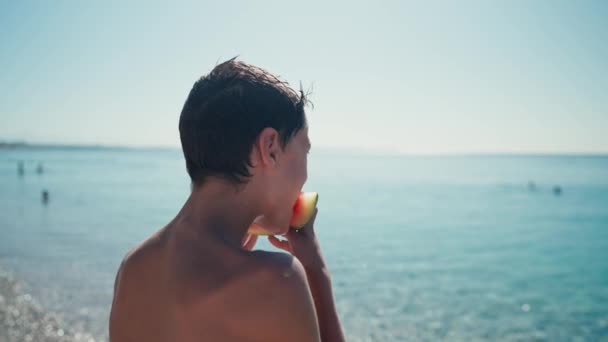 Boy Eating Watermelon Beach Summertime — Stockvideo