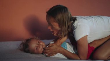 Happy mother with little son. Hes such a happy little soul