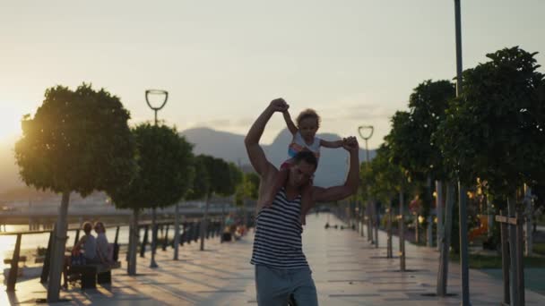 Father Son Walking City Sunset Two Year Old Kid Sitting — Stockvideo