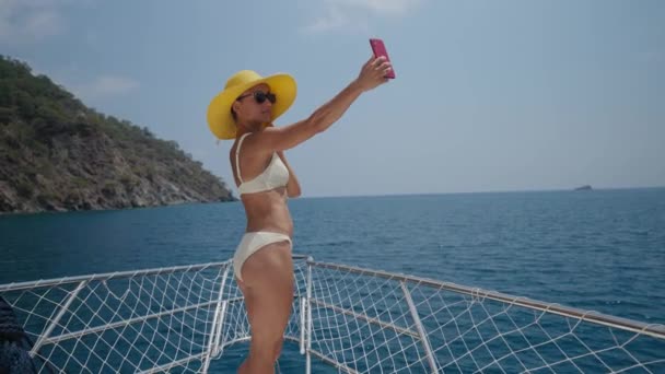 Young Woman Taking Photo Selfie Bow Yacht She Look Happy — kuvapankkivideo