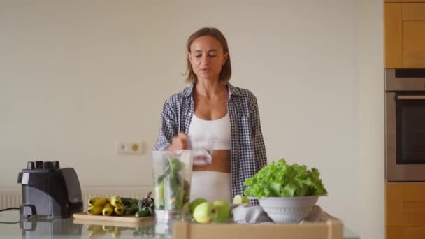 Young Sportswoman Putting Washed Greenery Table Cooking Smoothie Happy Vegetarian — ストック動画