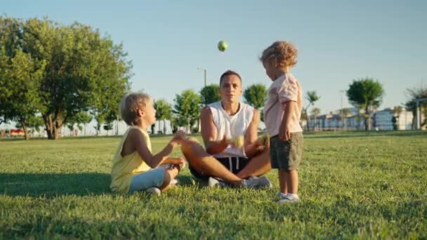 Happy Father Juggling Green Apples Park His Kids High Quality — Stockvideo