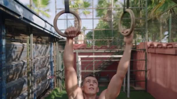 Strong Man Performing Pull Ups Gymnastic Rings Slow Motion High — Vídeo de Stock