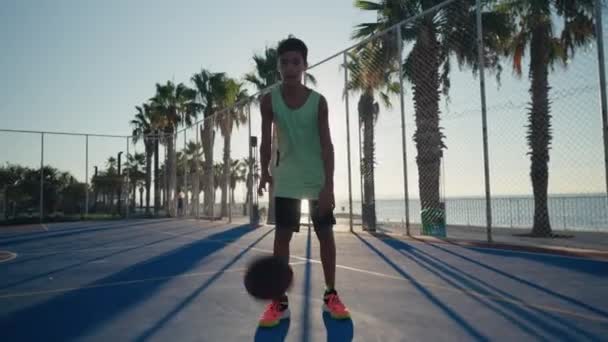 Year Old Boy Bouncing Basketball Ball Training Ground Floor Court — Vídeos de Stock