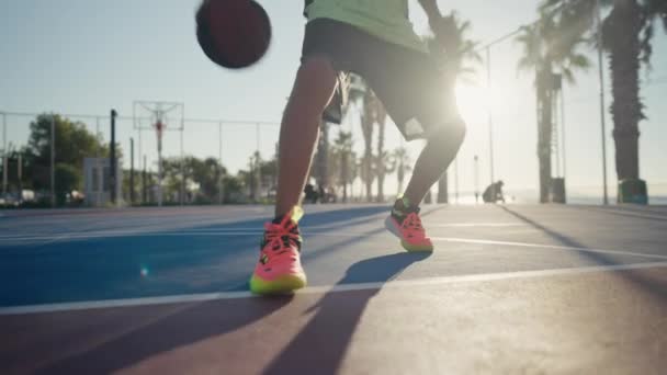 Year Old Boy Bouncing Basketball Ball Training Ground Floor Court — Vídeo de stock