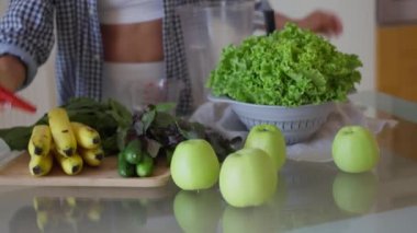 Happy caucasian woman using blender, preparing smoothie in kitchen. healthy lifestyle and enjoying leisure time at home. High quality 4k footage
