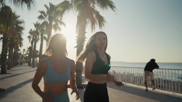 Two Beautiful Girls Jogging Sunset Sunrise Beach Young Caucasian Women — стоковое видео