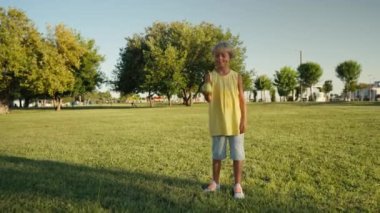 Child throwing up an apple. Healthy Life Healthy Food.