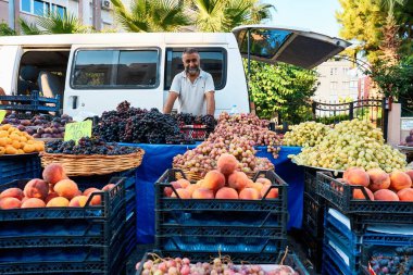 ANTALYA, TURKEY - SEPTEMBER 3, 2022: People at the local traditional market at Konyaalti Liman in Antalya, Turkey. High quality photo