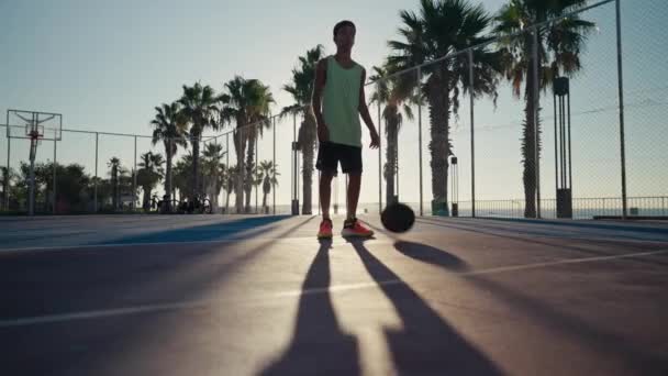 Year Old Boy Bouncing Basketball Ball Training Ground Floor Court — Vídeos de Stock